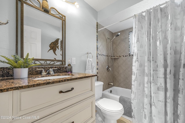 full bathroom with vanity, shower / bath combo, and toilet