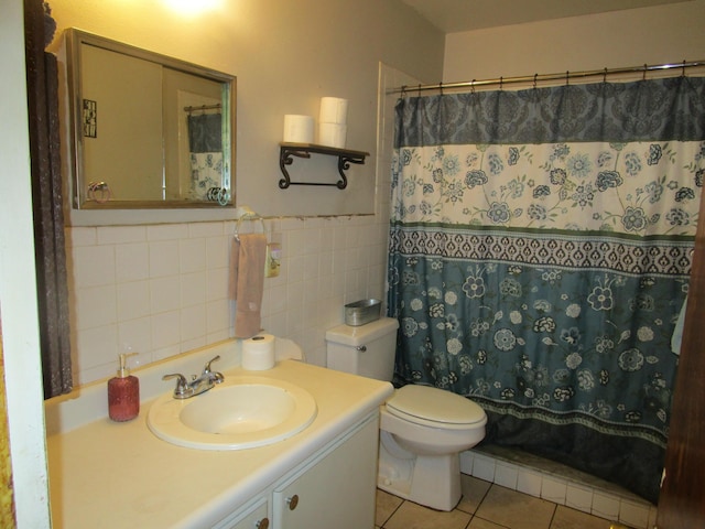 bathroom with a shower with shower curtain, tile patterned floors, vanity, tile walls, and toilet