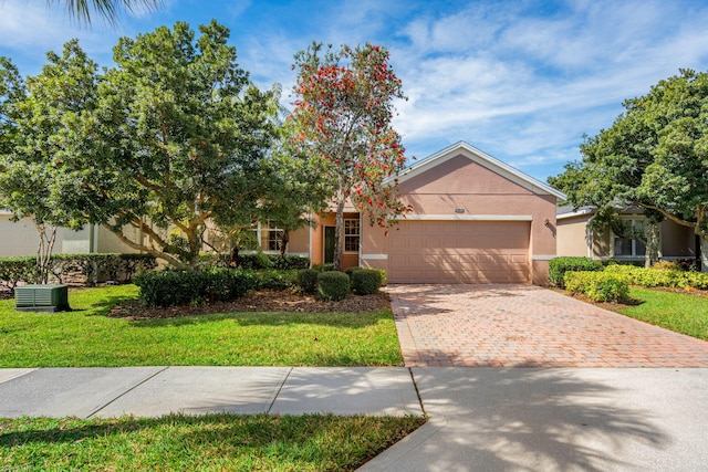 view of front of house featuring a garage and a front yard