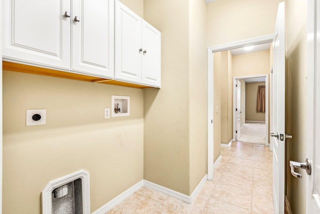 laundry area with cabinets, electric dryer hookup, light tile floors, and hookup for a washing machine