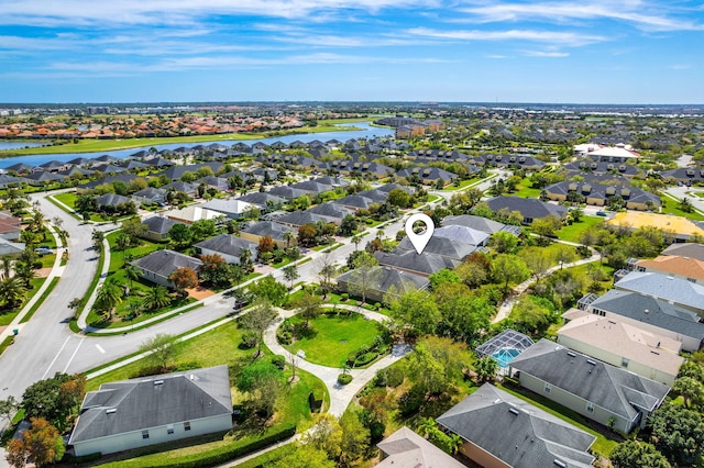 birds eye view of property featuring a water view