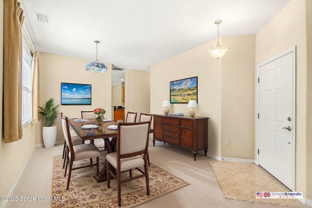 dining area with light carpet