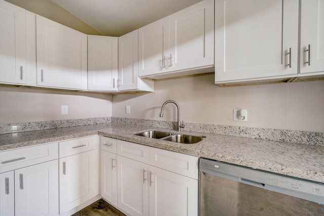 kitchen with white cabinetry, stainless steel dishwasher, and sink