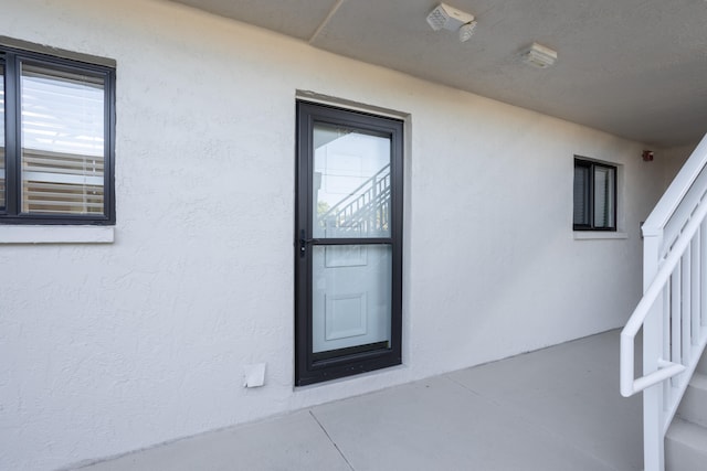 property entrance with a patio area