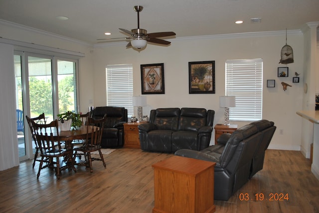 living room featuring ornamental molding, ceiling fan, and dark hardwood / wood-style flooring