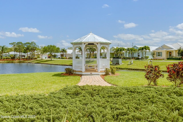 view of nearby features featuring a lawn, a water view, and a gazebo