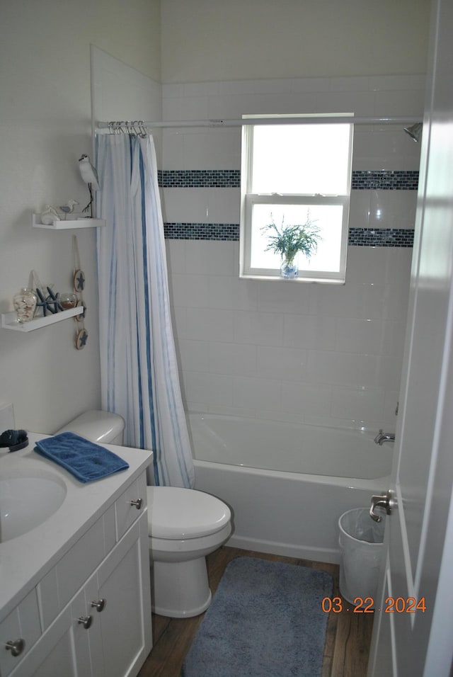 full bathroom featuring shower / tub combo, vanity, toilet, and hardwood / wood-style flooring