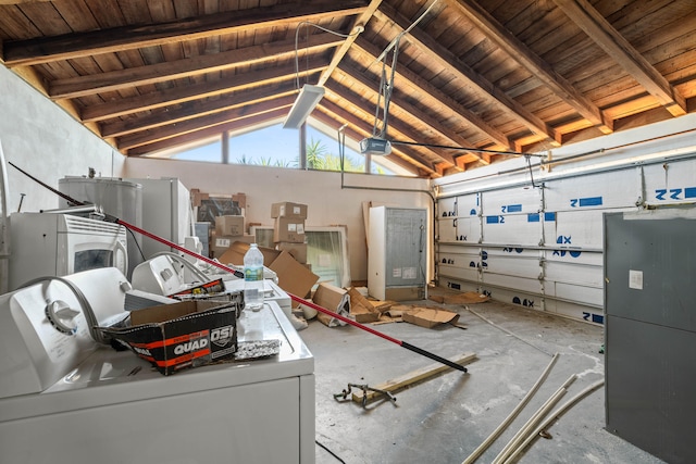 garage featuring washer and dryer, a garage door opener, and wood ceiling