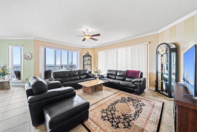 living room featuring light tile floors, crown molding, a textured ceiling, and ceiling fan