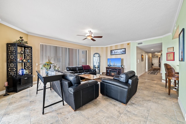 tiled living room with ceiling fan, crown molding, and a textured ceiling