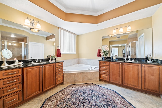 bathroom featuring dual sinks, tile floors, and vanity with extensive cabinet space