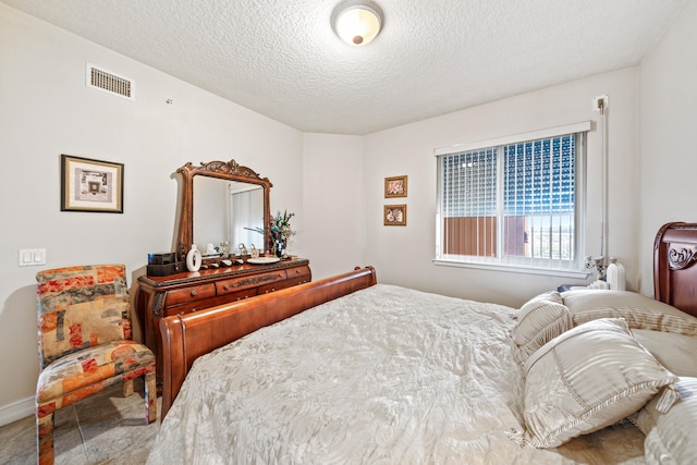 bedroom featuring a textured ceiling