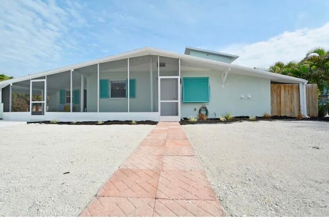 view of front of property with a sunroom