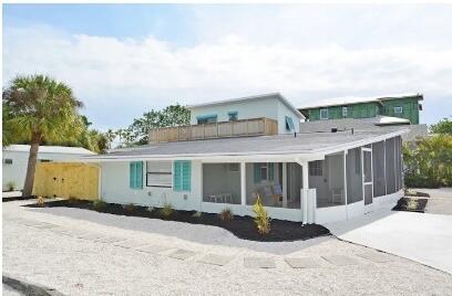 view of front of house featuring a sunroom