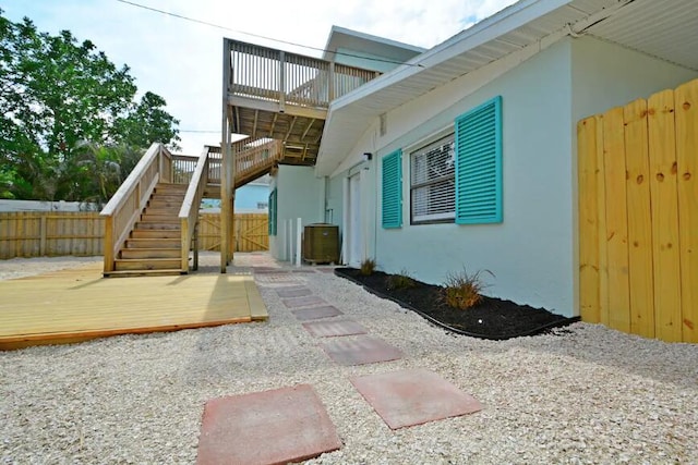 rear view of property with a wooden deck