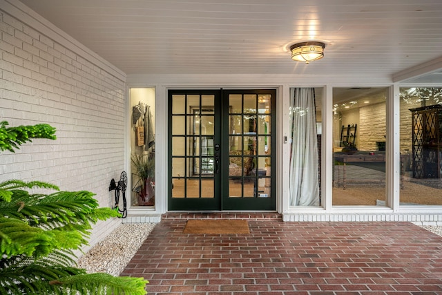 view of exterior entry featuring french doors