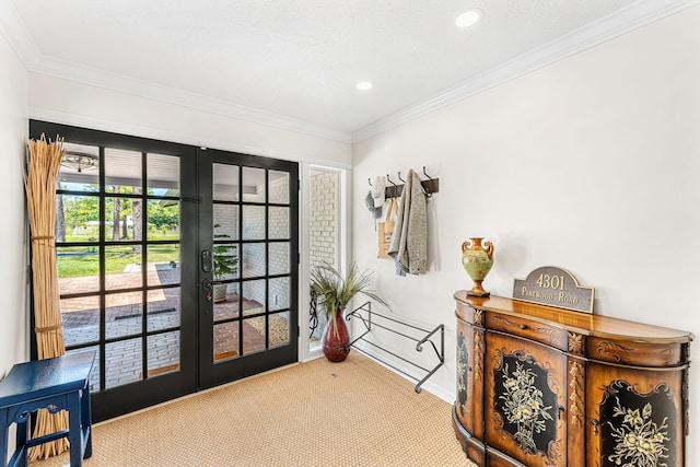 interior space featuring carpet, french doors, and crown molding