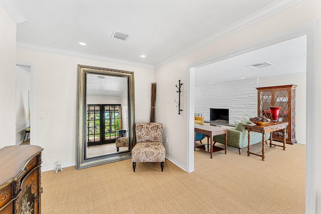 sitting room with french doors, a stone fireplace, light colored carpet, and a textured ceiling