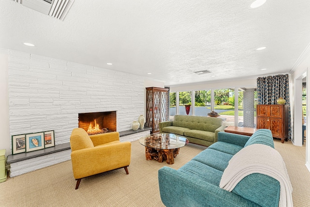 living room with a fireplace and a textured ceiling