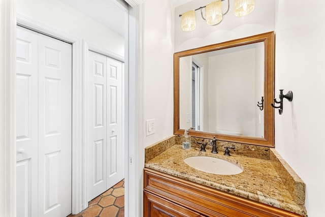 bathroom with tile flooring and vanity