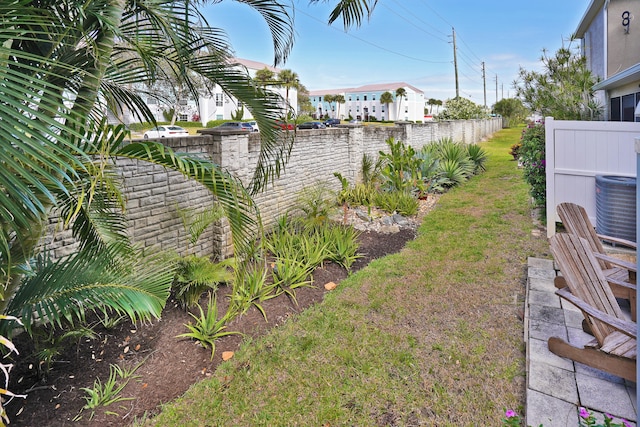 view of yard with central AC unit