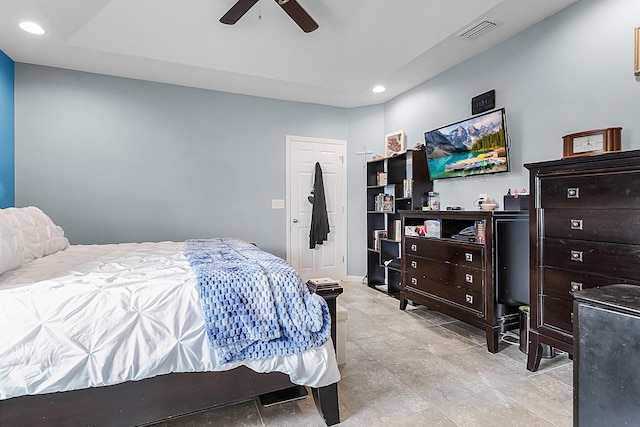 tiled bedroom featuring ceiling fan