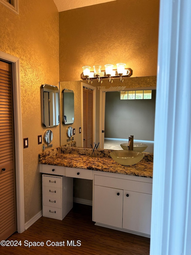 bathroom with vanity and hardwood / wood-style flooring