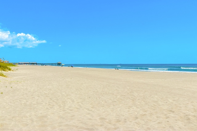 property view of water featuring a beach view