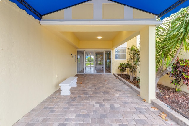 entrance to property featuring a patio area