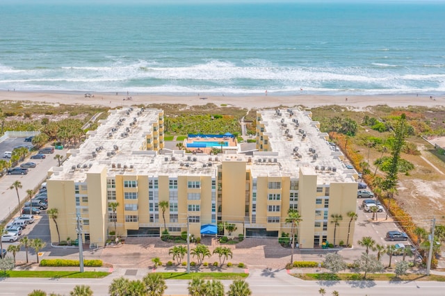 aerial view featuring a water view and a beach view