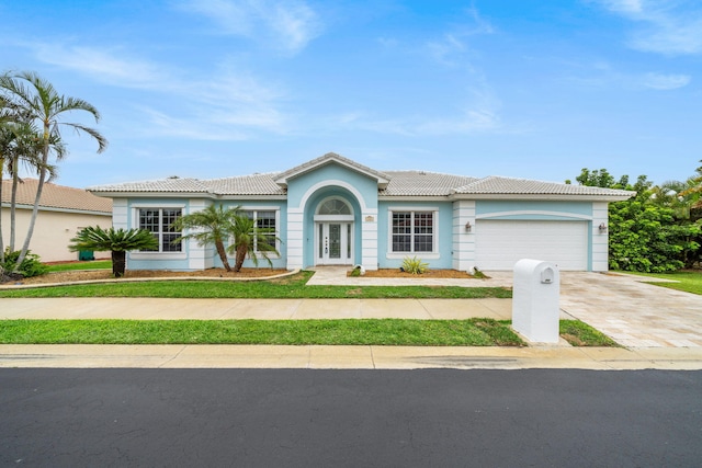 ranch-style home with a garage