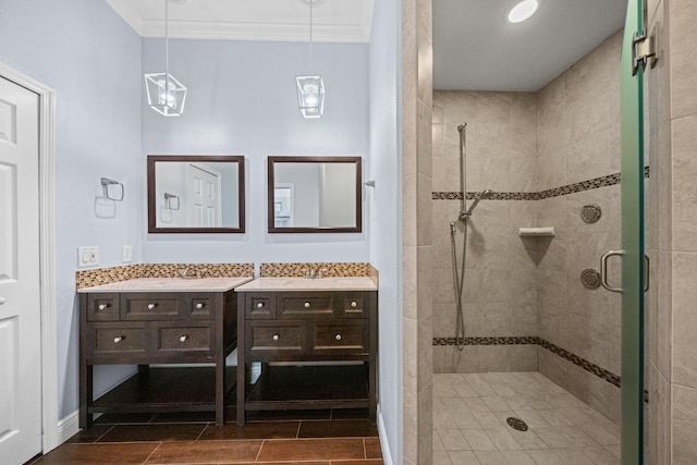 bathroom with tile flooring, ornamental molding, vanity, and a shower with door