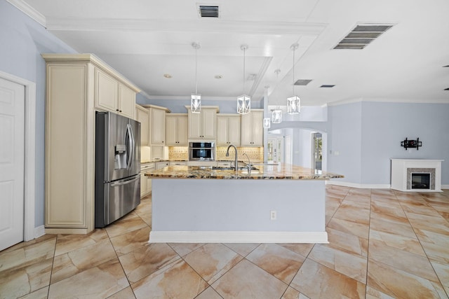 kitchen featuring backsplash, hanging light fixtures, stainless steel appliances, and light stone countertops