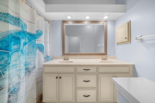 bathroom with dual sinks and large vanity