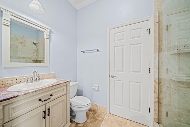 bathroom featuring crown molding, tile flooring, toilet, vanity, and walk in shower