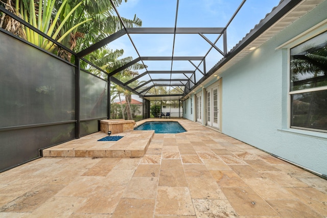 view of swimming pool with french doors, glass enclosure, a patio, and a hot tub