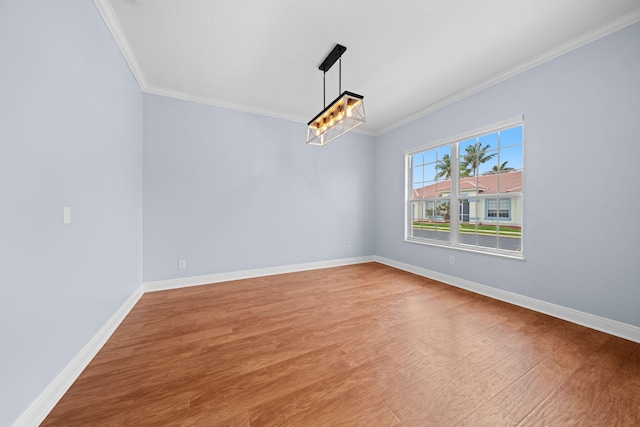 unfurnished room featuring light hardwood / wood-style floors and crown molding