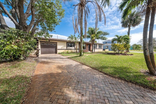 ranch-style house with a front lawn and a garage