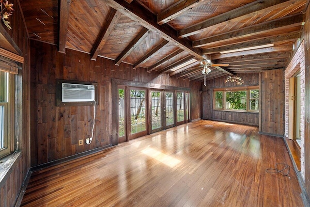 unfurnished room featuring wooden walls, wood ceiling, dark hardwood / wood-style flooring, and lofted ceiling with beams