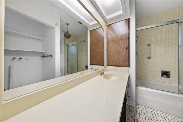 bathroom featuring combined bath / shower with glass door, tile floors, and vanity with extensive cabinet space