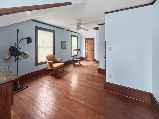 living area with ceiling fan, baseboards, and hardwood / wood-style floors