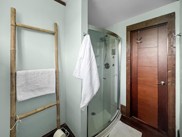 full bathroom featuring a shower stall