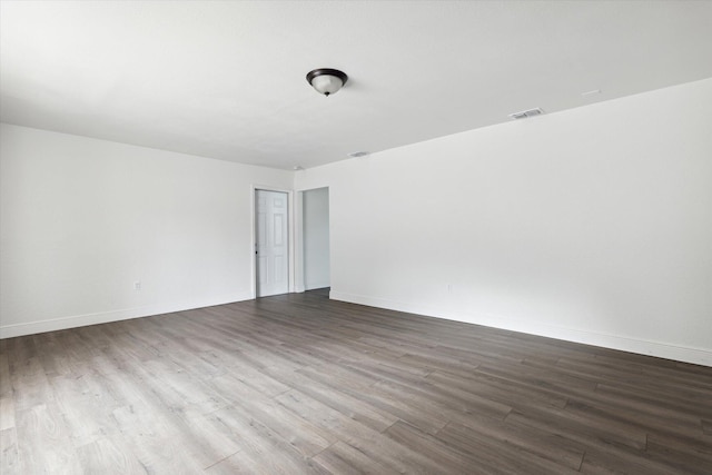 unfurnished room with hardwood / wood-style floors