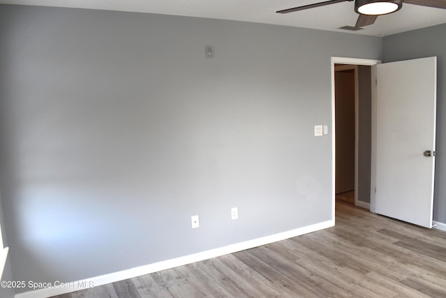 unfurnished room featuring light hardwood / wood-style flooring and ceiling fan