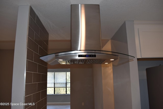 details featuring white cabinetry and extractor fan