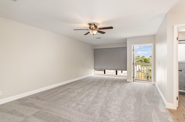 carpeted empty room with ceiling fan