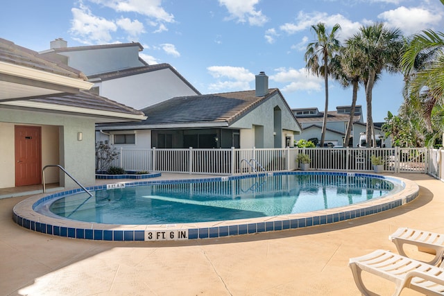 view of pool featuring a patio