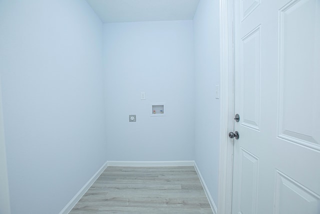 clothes washing area with hookup for an electric dryer, washer hookup, and light wood-type flooring