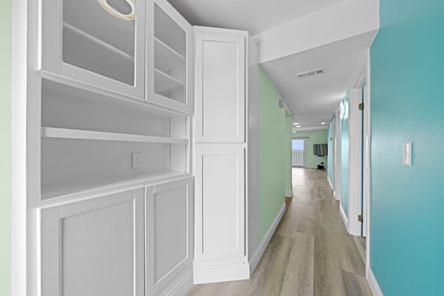 hallway featuring light hardwood / wood-style flooring