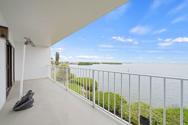 balcony featuring a water view